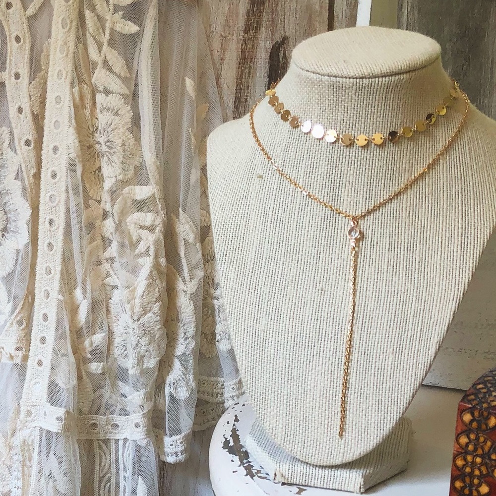 Gold choker necklace with crystal pendant